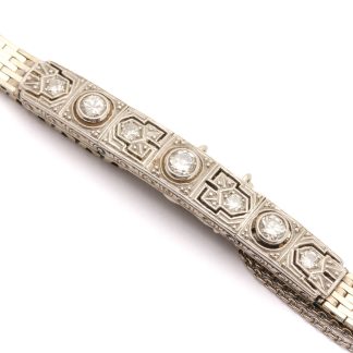 ARMBAND I VITGULD MED DIAMANTER TOT. CA: 0,40CT, MED SÄKERHETSKEDJA, CA: 16,5CM, BREDD: 6MM