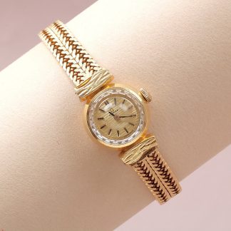 DAMUR OMEGA MEKNISK 18K I UR OCH LÄNK. ORIGINAL INNER OCH YTTER LÅDA. TOTALVIKT 35,4G