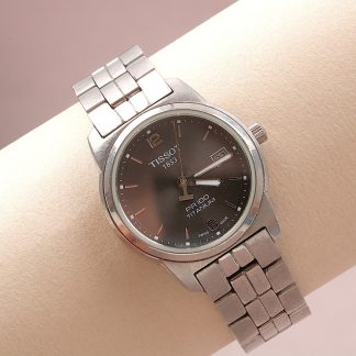 DAMUR TISSOT PR100 TITANIUM. NÅGOT REPIG LÄNK